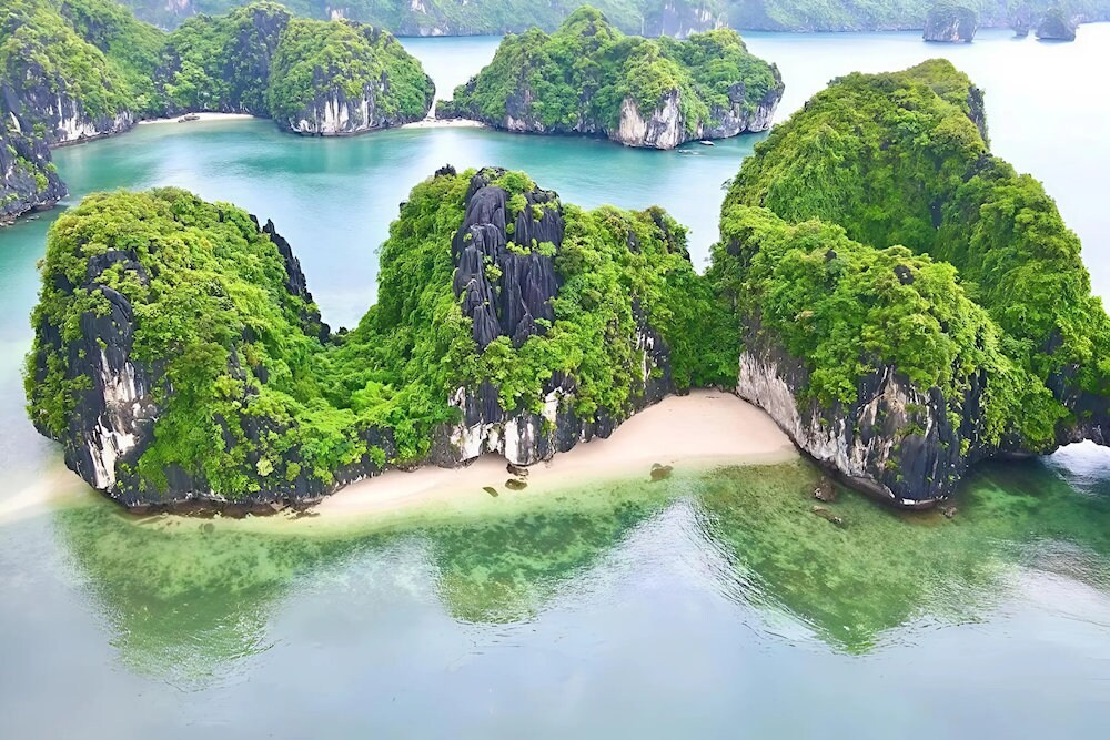 A secluded beach with clear water, only accessible by boat